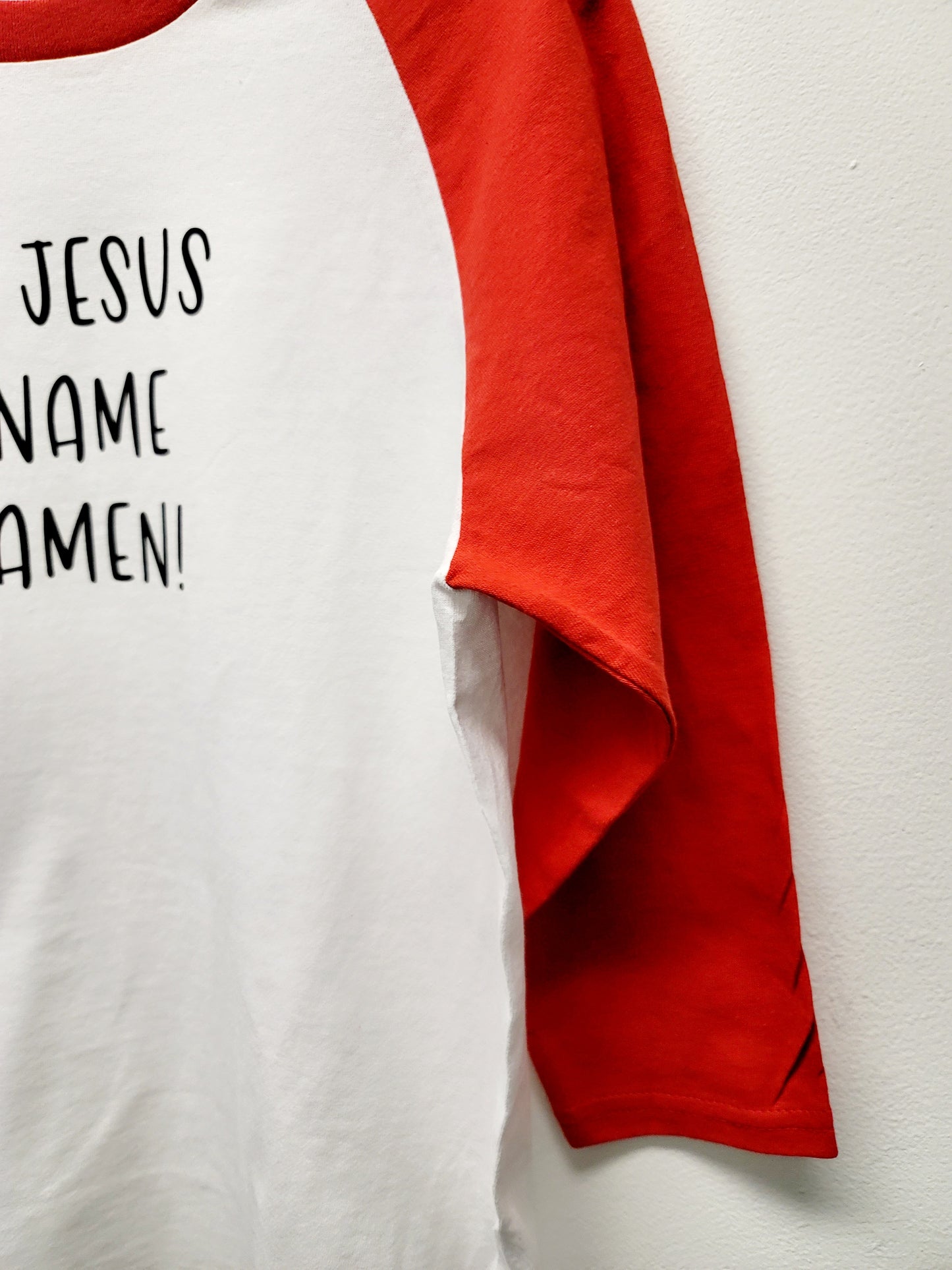 In Jesus name Amen shirt with red raglan sleeve