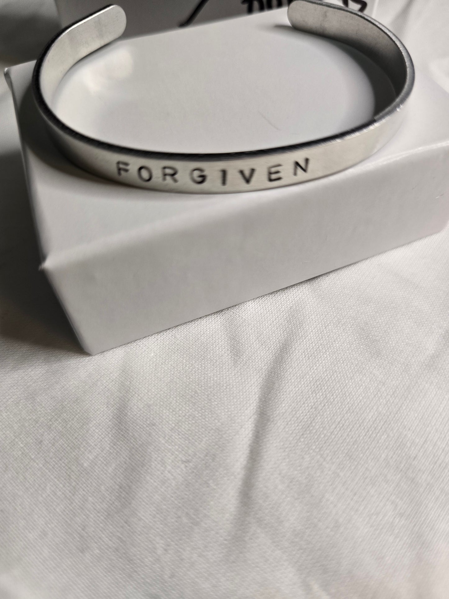 Forgiven metal bracelet