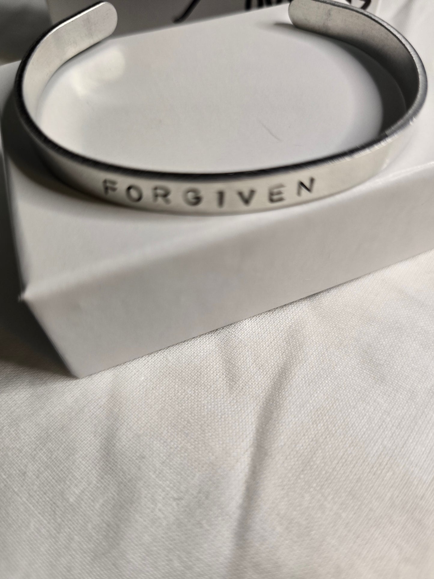 Forgiven metal bracelet
