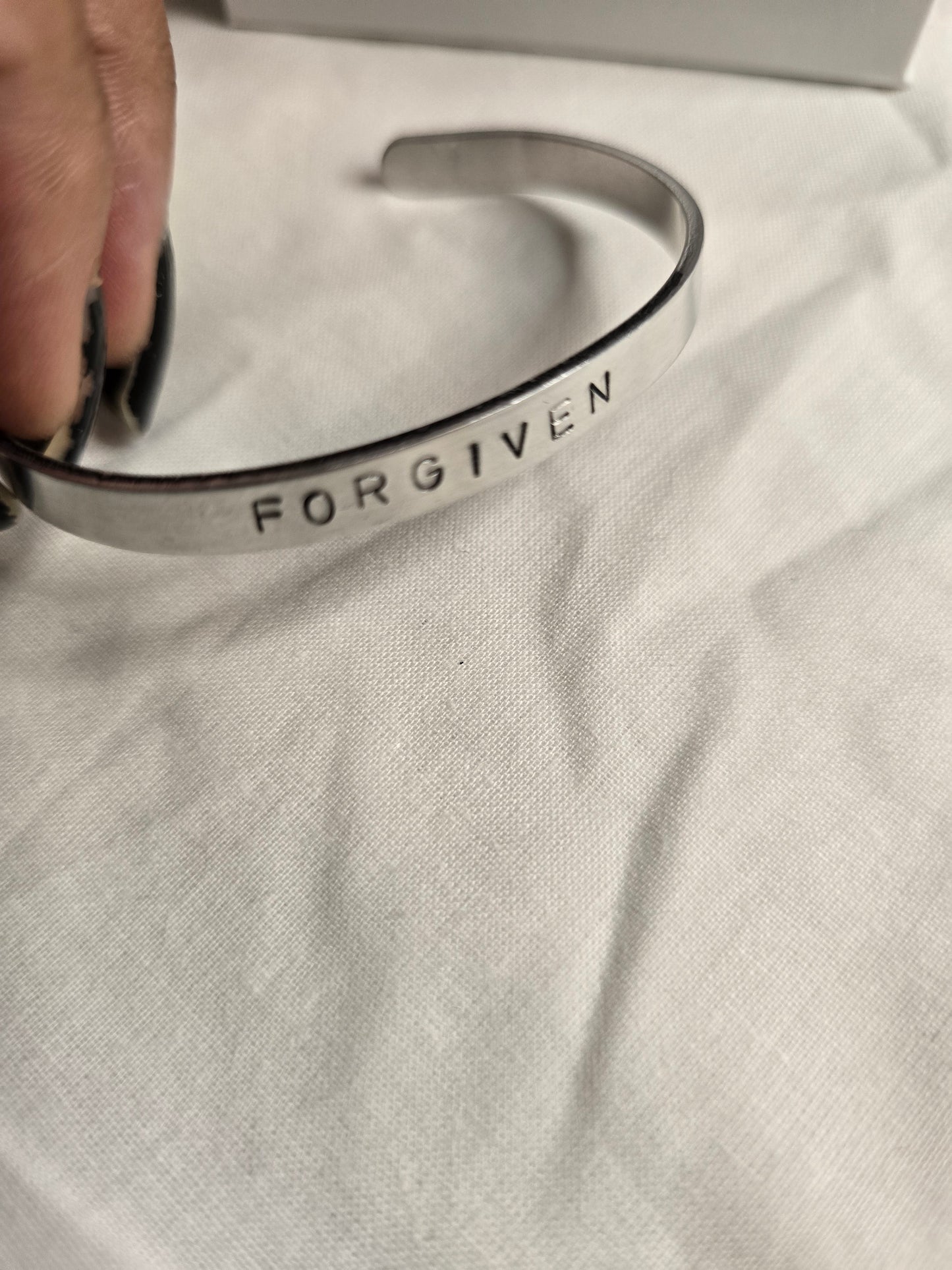 Forgiven metal bracelet