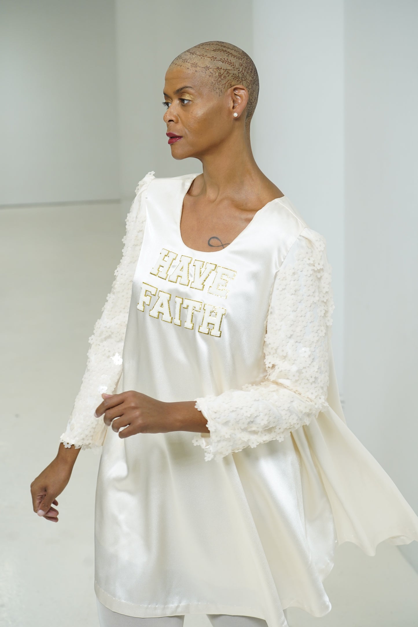 Have Faith tunic with textured sleeves