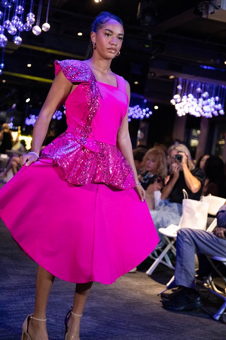 Pink sleeveless dress with peplum and shoulder detail