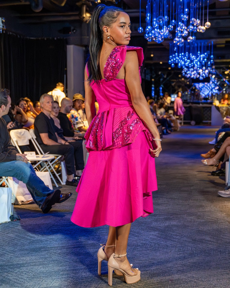 Pink sleeveless dress with peplum and shoulder detail
