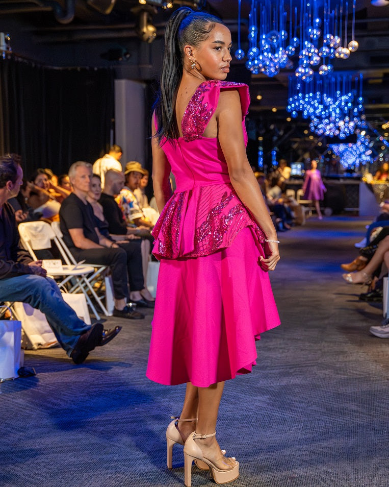 Pink sleeveless dress with peplum and shoulder detail