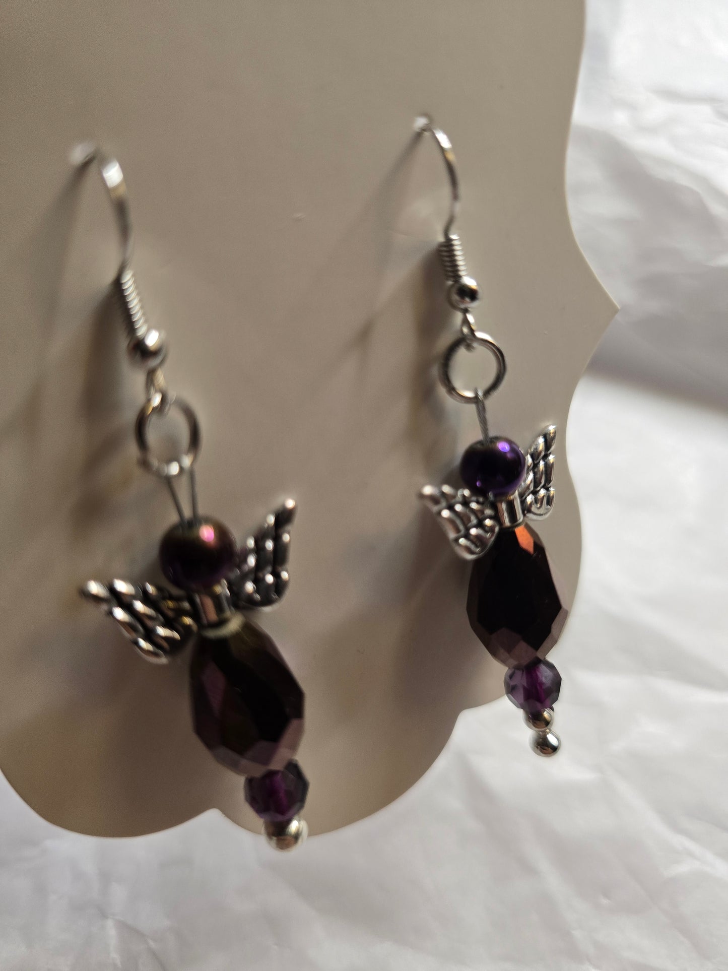 Purple angel design earrings